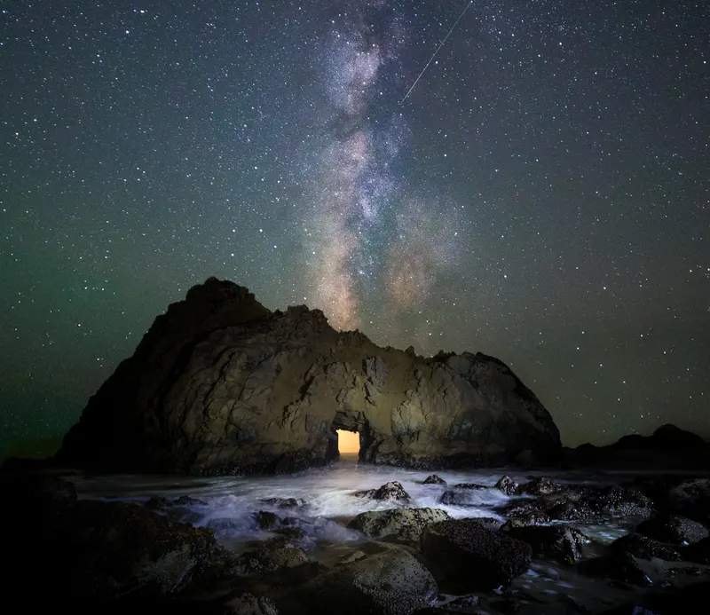 Glowing Cave Under the Milky Way